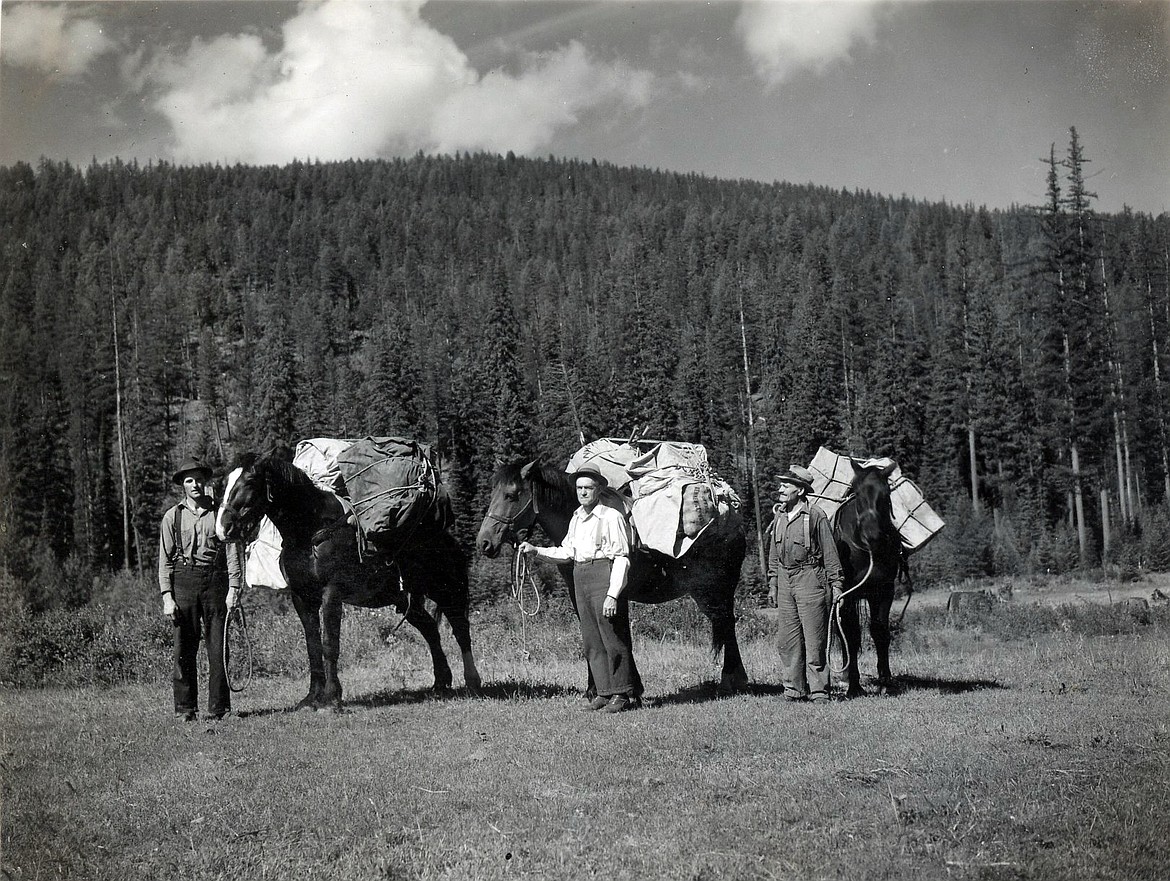 George Colby, Glen Locke and James Adams at the base of Blacktail Mountain preparing to take supplies to the lookout there on June 27, 1938. Alfred Williams manned the lookout that season. (A.E. Boorman photo)