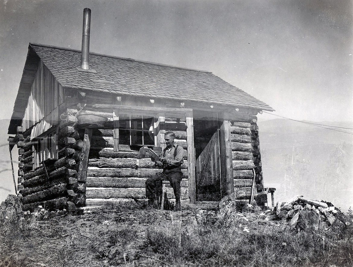 Harry Fulmer sits at his post outside the Haskill Mountain Lookout in the summer of 1937. (A.E. Boorman photo)
