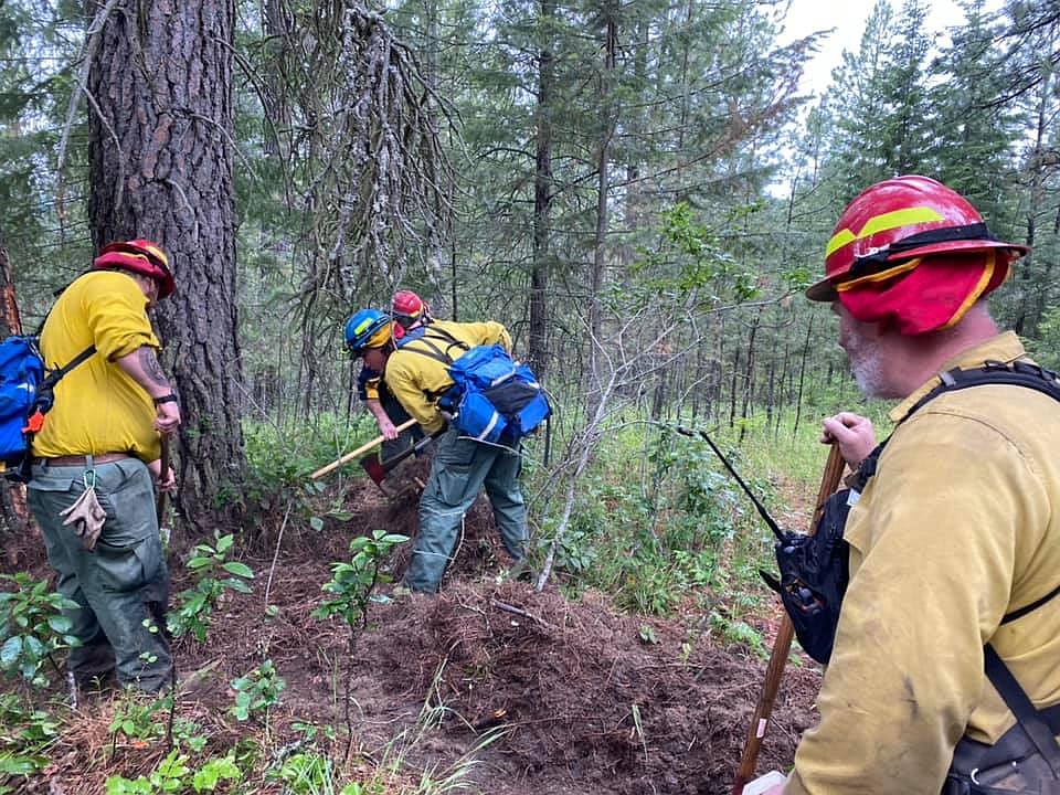 (Photo courtesy of North Bench Fire Department)
Firefighters digging a fire line around the Sandy Fire

Pictured: NBFD Firefighter Hurst, NBFD Firefighter Chaney (red helmet) NBFD Trainee Doyle (blue helmet), NBFD Firefighter Kelly.