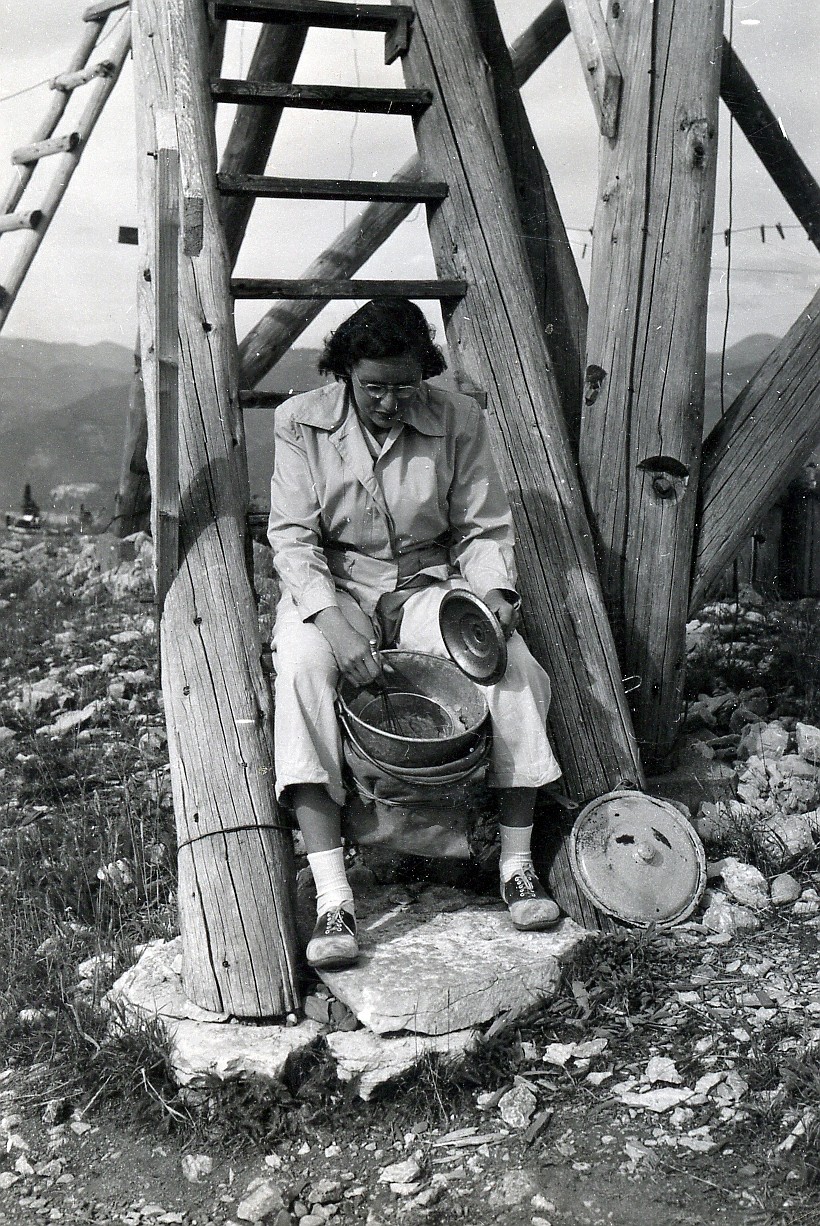 Rebecca McNees Osborn washes pots on the stairs of the Spotted Bear Lookout during her honeymoon there with Joe Osborn in the summer of 1948. (Joe Osborn photo)