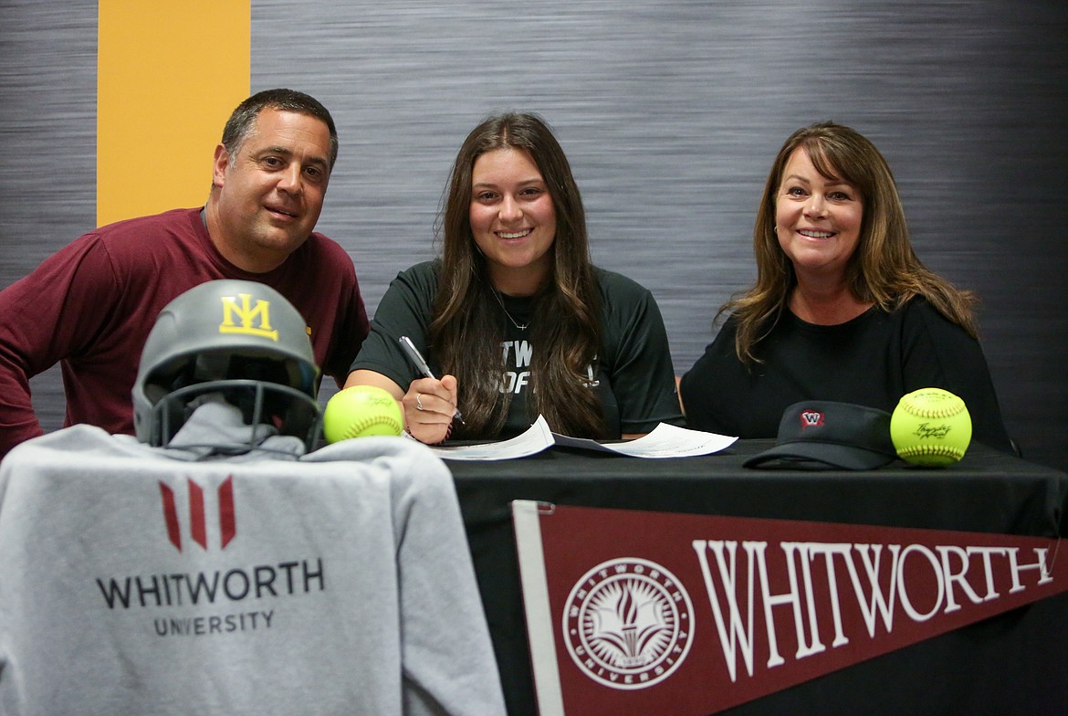 Left to right, Mike Hofheins, Taylor Hofheins and Kristi Hofheins gather at Moses Lake High School on Thursday afternoon to celebrate Taylor signing to play softball at Whitworth University next season.