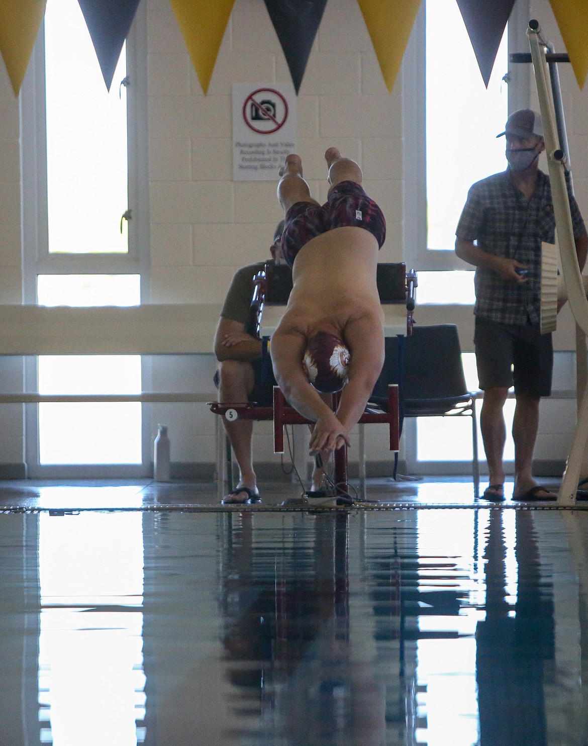 Moses Lake senior Ryan Jorgensen dives into the pool at the start of the final heat in the 50 yard freestyle event Thursday afternoon at Moses Lake High School.