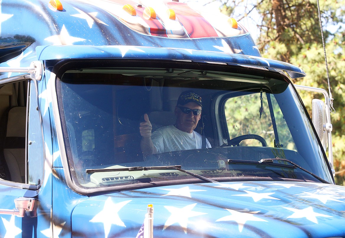 Bob Brock readies to hit the road on Thursday as he leaves the Huetter rest stop on his "Love America" tour.