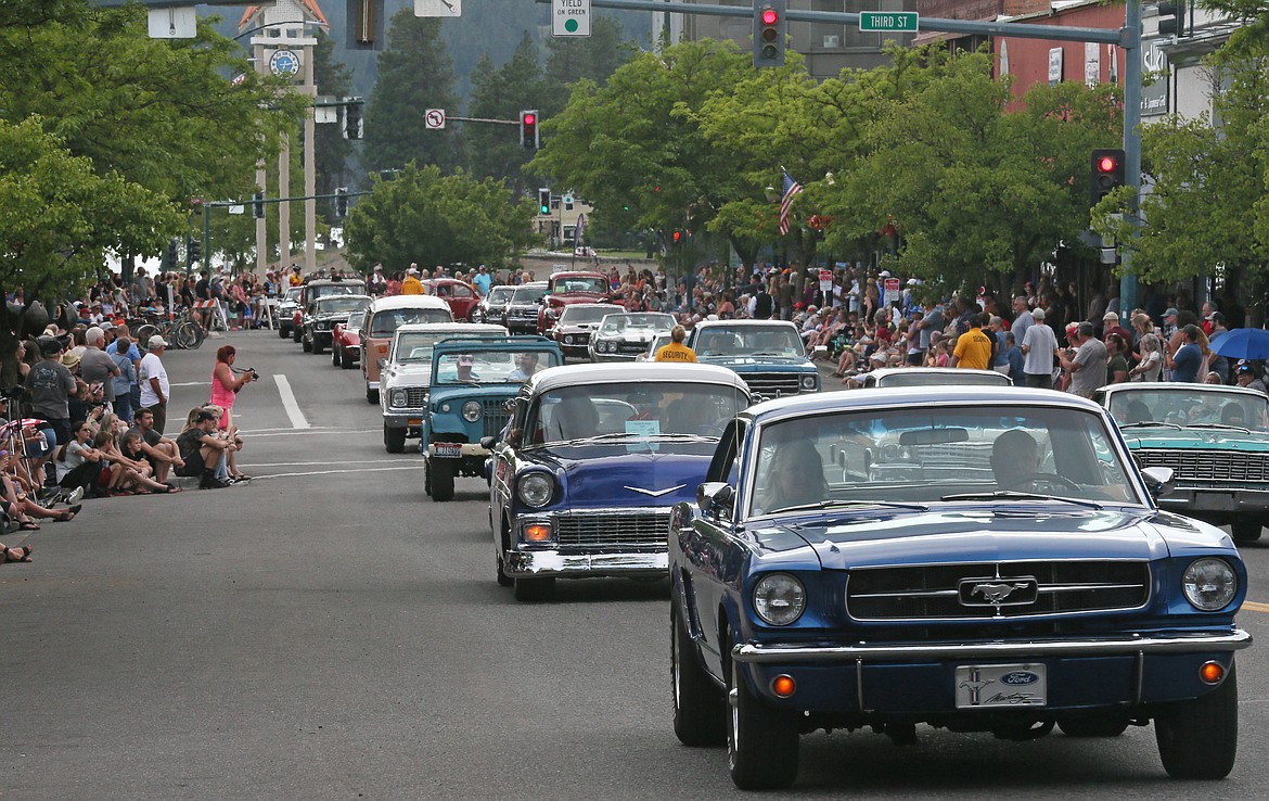 Spectators fill the sidewalks as more than 500 classic cars take to the streets in downtown Coeur d'Alene Friday evening for the return of Car d'Lane, which was not held last year because of the COVID-19 pandemic.