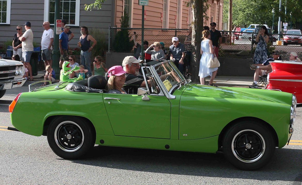 Tom and Karen Noble of Post Falls take Kermit the Frog for a spin in their 1976 MG Midget during the 30th annual Car d'Lane Cruise on Friday night.