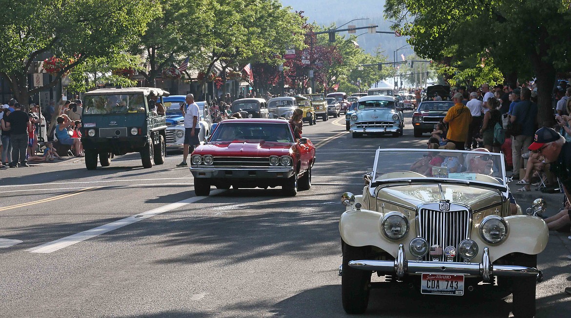 A plethora of vintage and classic cars cruise east on Sherman Avenue during the Car d'Lane Cruise on Friday evening. Car d'Lane, presented by the Coeur d'Alene Downtown Association, is celebrating its 30th year this year.