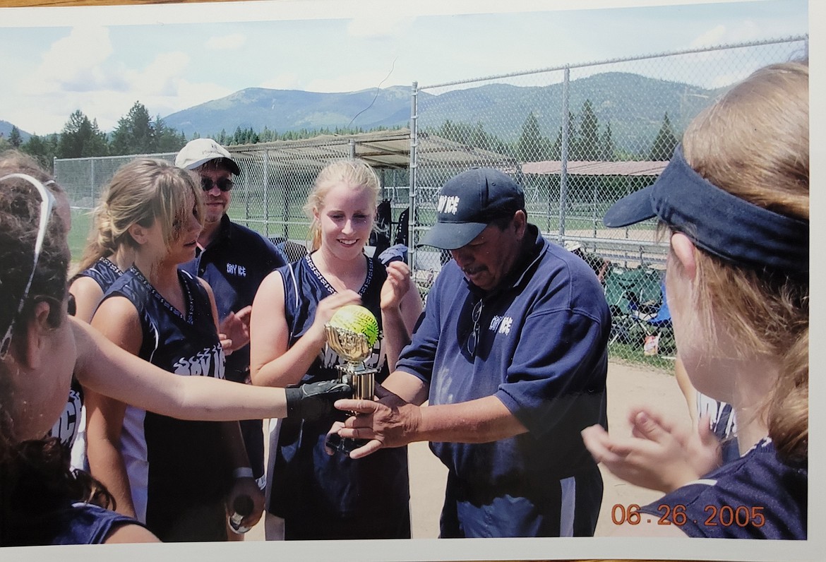Courtesy photo
In 2005, Dry Ice won the last tournament of the season, and the players signed a softball and presented it to Stacy Carhart as a thank you for coaching.