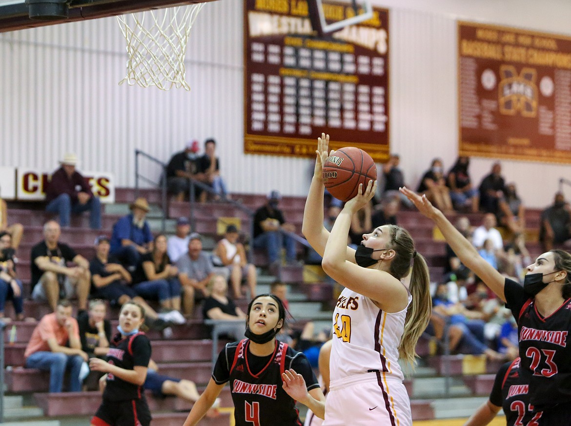 Moses Lake High School forward Meagan Karstetter goes up for a layup in the second half against Sunnyside on Saturday afternoon, June 19, in Moses Lake.