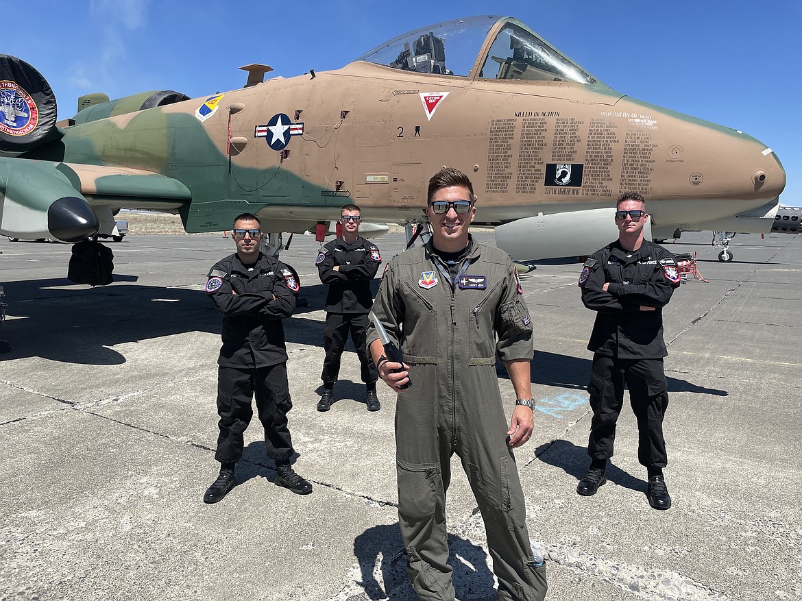 U.S. Air Force Capt. Sky Lesh holds an inert 30mm round fired by the A-10 Thunderbolt II (nicknamed “The Warthog”). Lesh, along with (from left to right) Tech. Sgt. Brian Pontes, Senior Airman Caleb Spencer and Staff Sgt. Robby Benson, are members of the Air Force’s A-10 Demonstration Team.