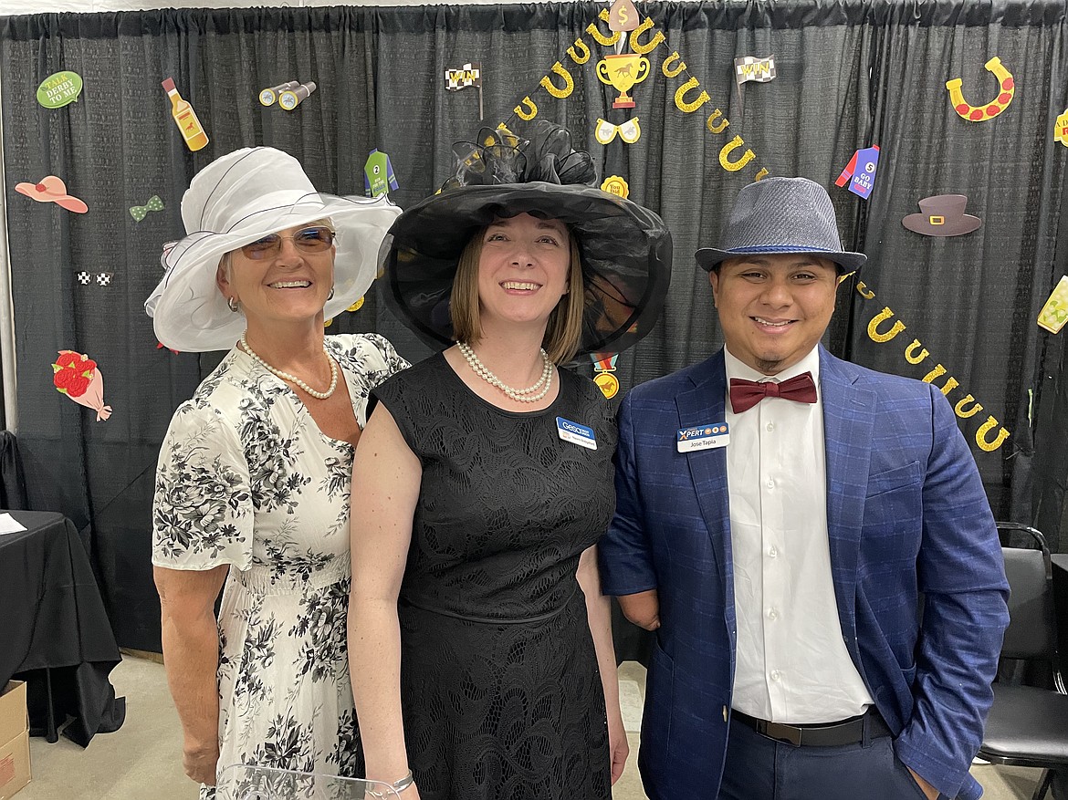 Joey Hansen, Naomi Bridgeford and Jose Tapia of Gesa Credit Union show off their Kentucky Derby finery at this year’s Moses Lake Business Expo, held last week at the Grant County Fairgrounds.