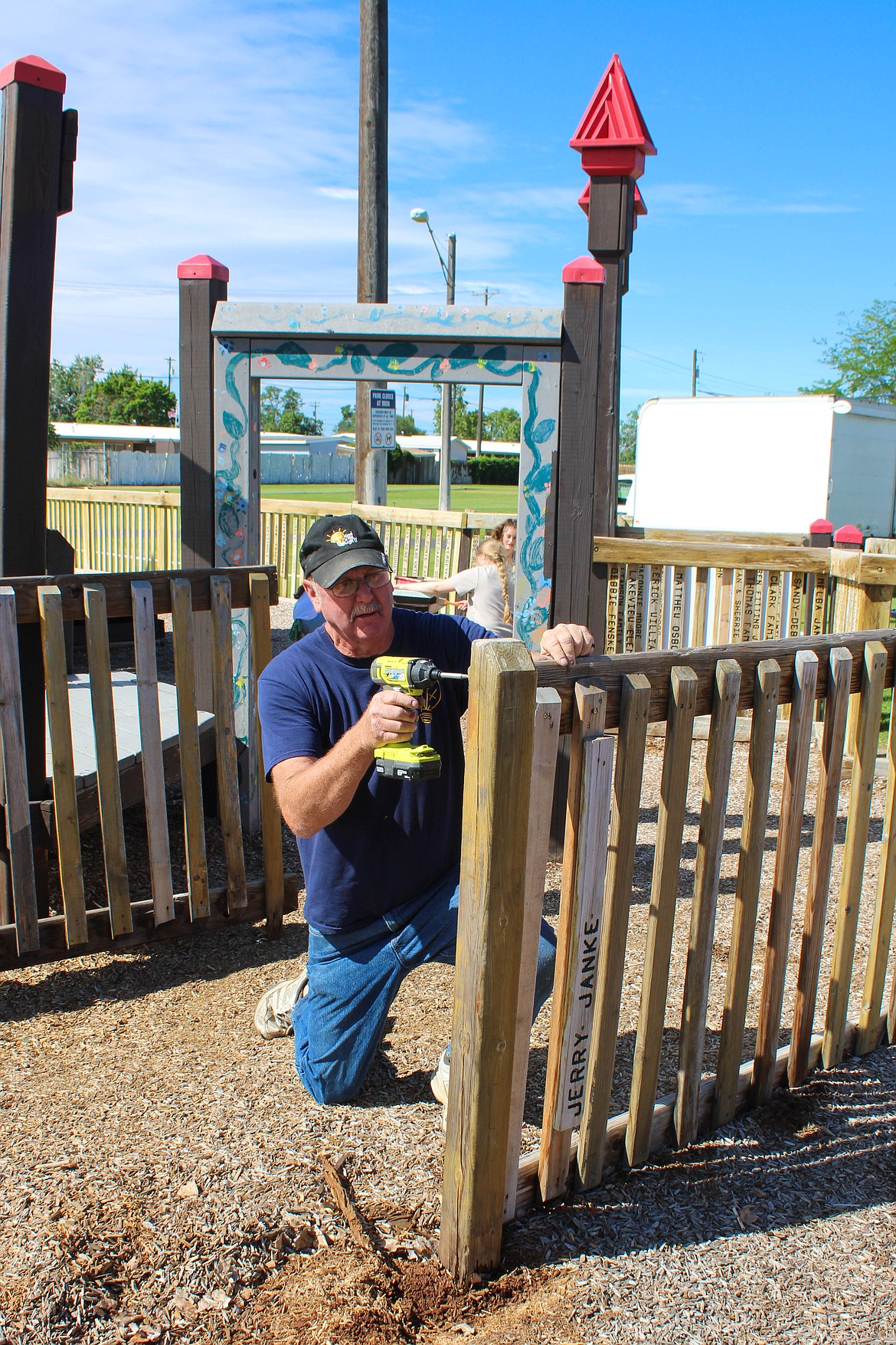 Light of Larson Church Pastor Art Brown works on new posts at the Doolittle Dream Park on Saturday.