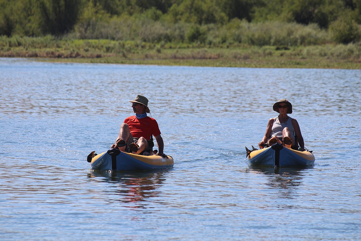 Two kayakers take to the water on Potholes Reservoir.