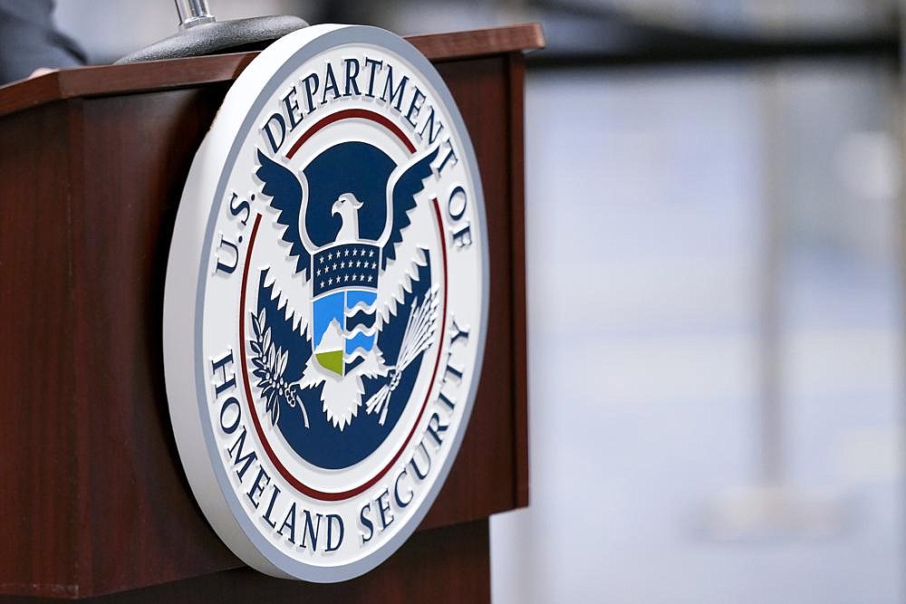 A U.S. Department of Homeland Security plaque is displayed at a podium where international passengers arrive at the Miami International Airport in this Nov. 20, 2020, file photo. (Lynne Sladky/Associated Press)