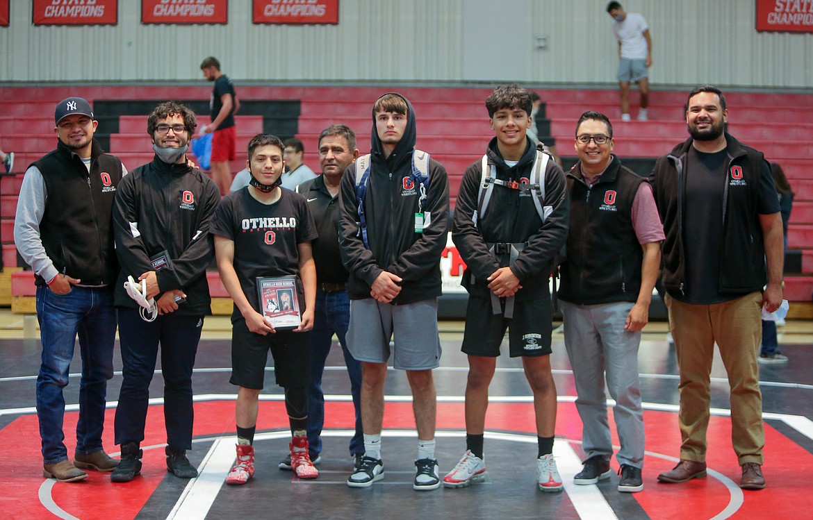 Left to right, Othello coach Edgar Mendez, seniors Anthony Trujillo, Miguel Amezola, coach Rudy Ochoa, seniors Jonathan Gomez, Arturo Solorio, coach Sammy Rocha and head coach Rudy Ochoa II stand together for a photo after wrapping up their final home meet of the season.