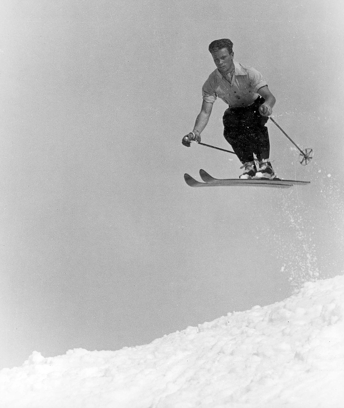 Toni Matt takes to the air. A former Austrian National Junior Champion, Matt was the ski school director at Big Mountain from 1949 to 1955. He was also instrumental in laying out
the downhill race course when Big Mountain hosted the 1949 and 1951 US National Championships. A prominent ski run at Whitefish Mountain Resort bears his name. (Courtesy photo)