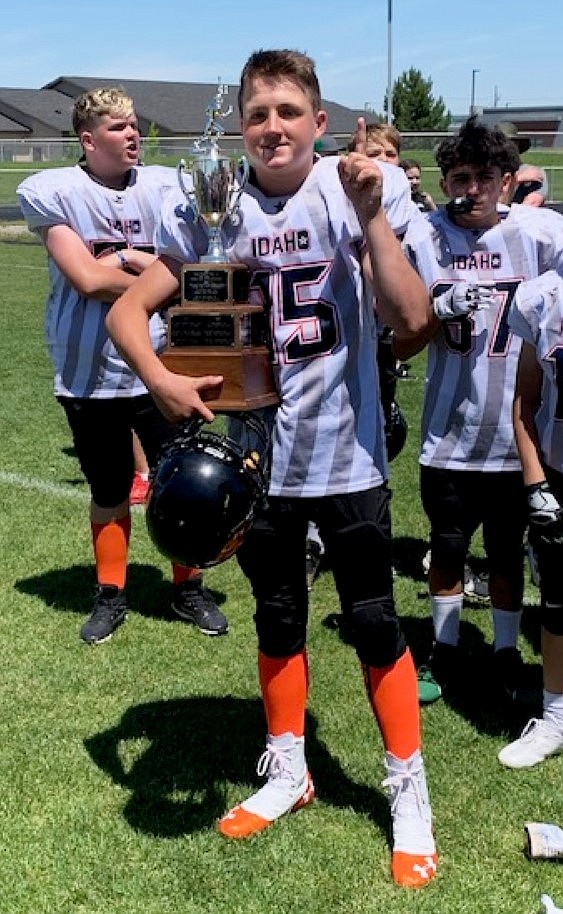 Gavin Griesemer poses for a photo with the seventh grade All-State game championship trophy.