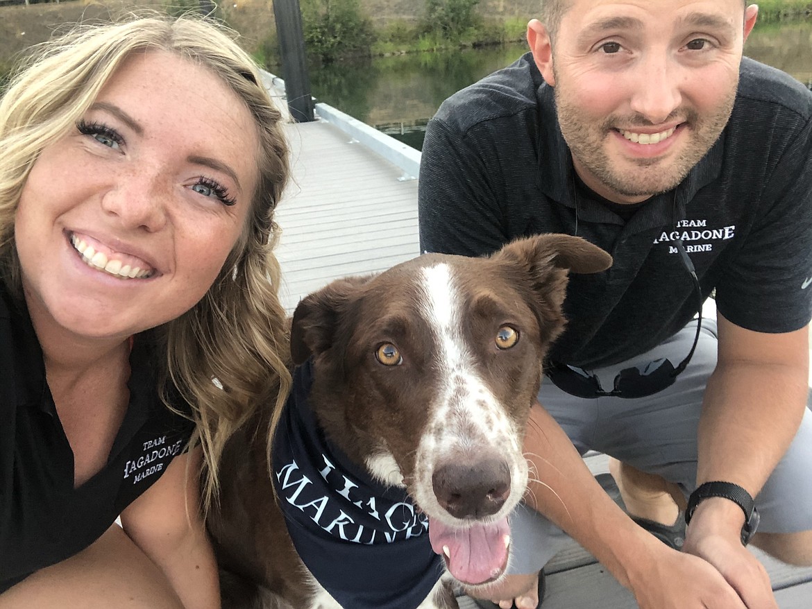 Jade and Christian Harlocker are seen here with their dog, Reddington, before he was shot in the eye with a metal pellet on Saturday evening. Red had to have his eye removed and is expected to recover.