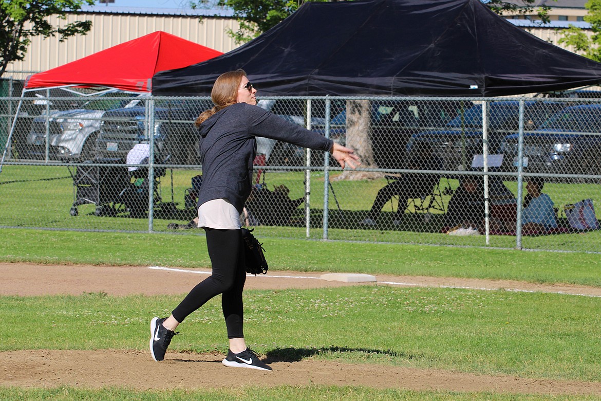 Pete Doumit’s daughter Amy Nelson throws the ceremonial pitch Saturday morning, kicking off the Pete Doumit Memorial Tournament.