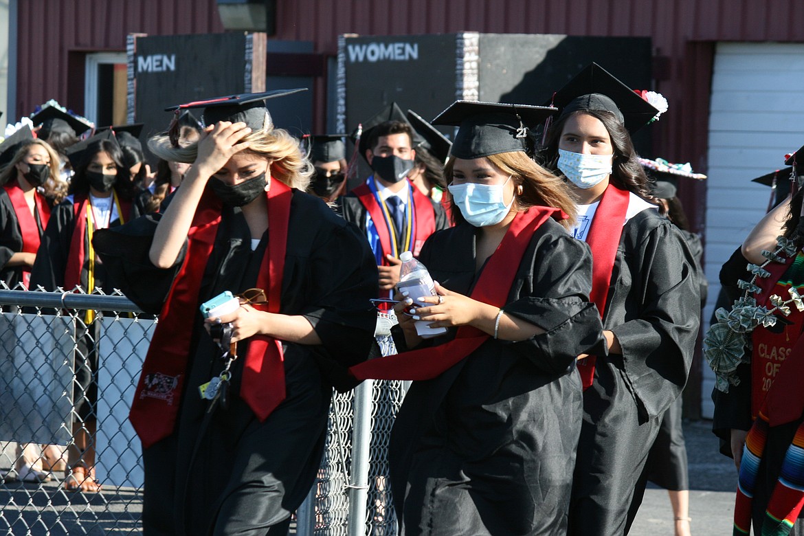 Wahluke High School seniors enter the football stadium at the beginning of graduation ceremonies in Mattawa June 18.
