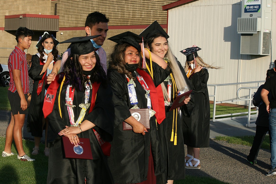 Wahluke graduates stop for a post-ceremony picture Friday in Mattawa.