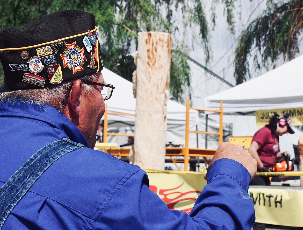 Melvin Quakenbush takes in the action at the Ronan Chainsaw Carving Rendezvous. (Emily Lonnevik/Lake County Leader)