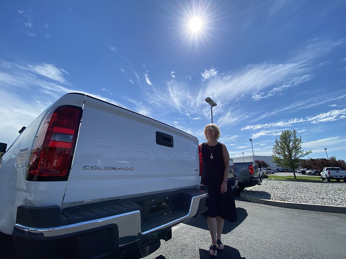 Knudtsen Chevrolet New Car Inventory Manager Katie Heckel says the drought in inventory is unlike anything she's seen in the last 30 years. Next to Heckel are three of the 33 available units currently sitting on Knudtsen's lot. (MADISON HARDY/Press)