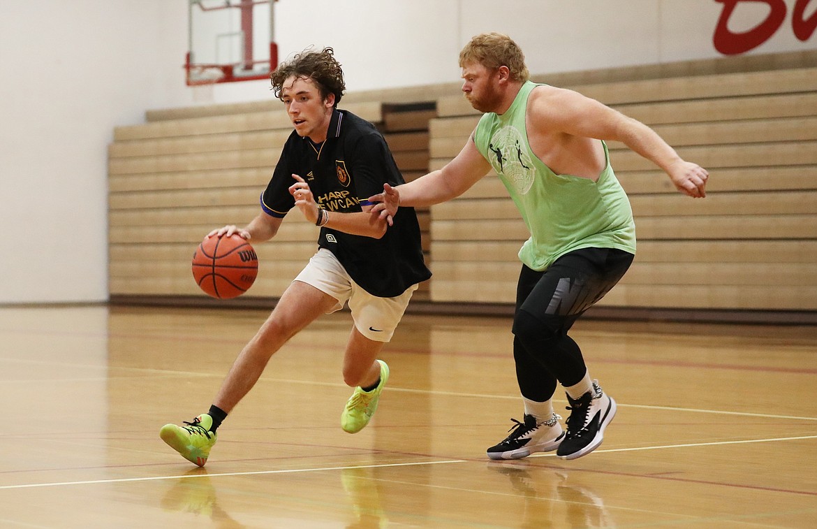 Randy Lane drives toward the paint during Thursday's open gym session at Les Rogers Court.