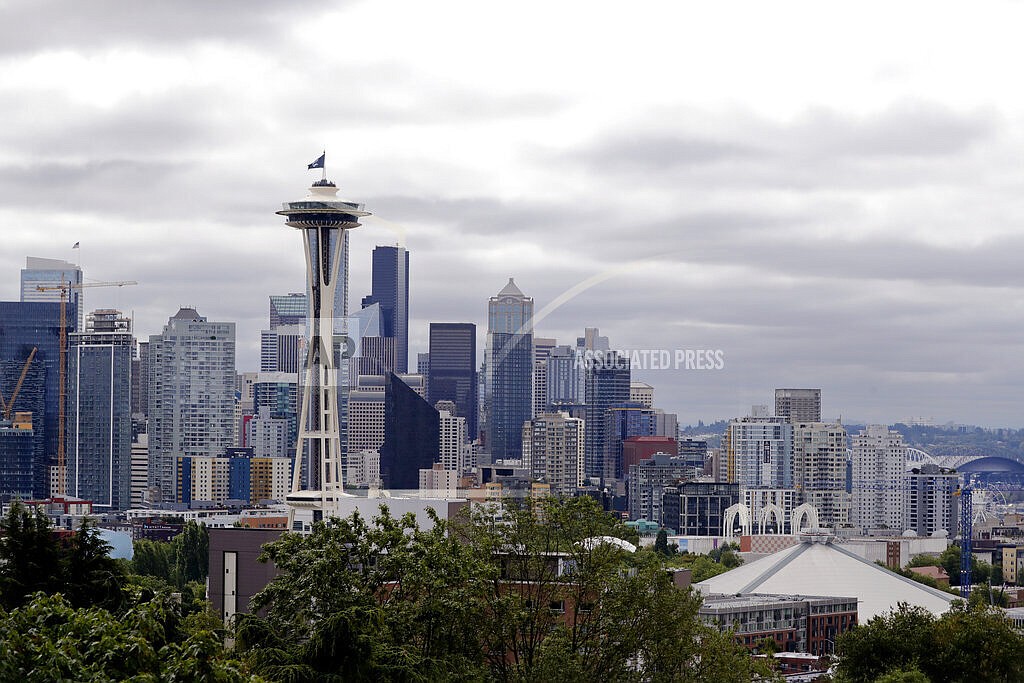 This July 23, 2020, file photo shows the view of the Space Needle, in Seattle. Record-high heat is forecast in the Pacific Northwest this weekend, raising concerns about wildfires and the health of people in a region where many don't have air conditioning. The National Weather Service has issued an Excessive Heat Watch and predicted “dangerously hot” conditions Friday, June 25, 2021, through at least Tuesday. (AP Photo/Elaine Thompson, File)