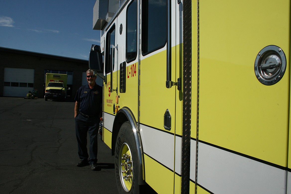 Dan Smith, chief of Grant County Fire District 5, with the district’s new ladder truck.