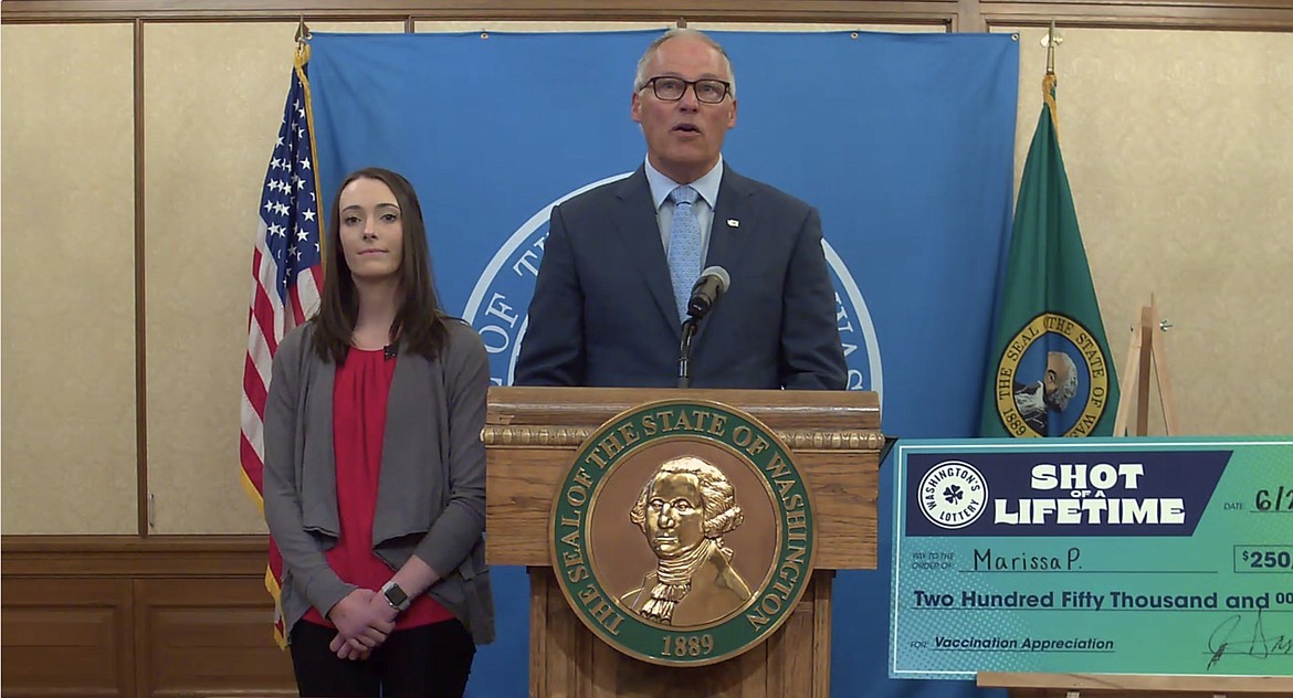 Gov. Jay Inslee (center) with Spokane nursing student Marissa P., the winner of this week’s $250,000 “Shot of a Lifetime” drawing, at an online press conference Thursday to announce some temporary changes to the state’s renter and landlord assistance programs.