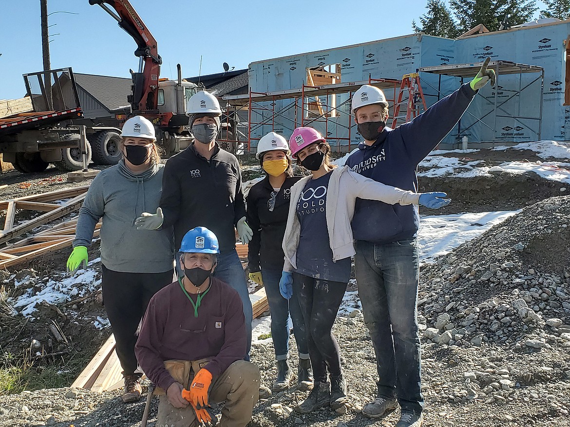 Employees of 100 Fold Studios, the architectural firm that designed Habitat for Humanity's Lakeside Affordable Housing Project, came out to lend a hand in the construction of Robert Zalewski's (kneeling) home. (photo provided)