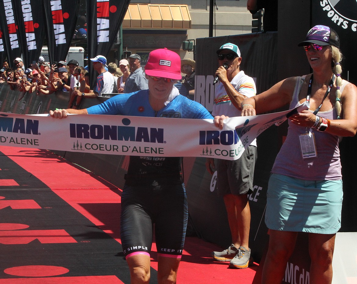 JASON ELLIOTT/Press
Carrie Lester, 40, of San Diego comes across the finish line in the women's race during Sunday's Ironman Coeur d'Alene. It was her eighth career win.