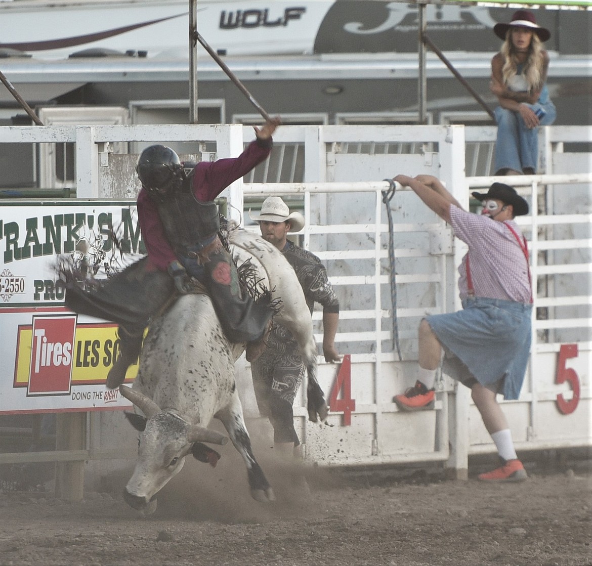 Polson bull rider Gavin Knutson takes a ride on Nonessential during the Mission Mountain Rodeo. (Scot Heisel/Lake County Leader)