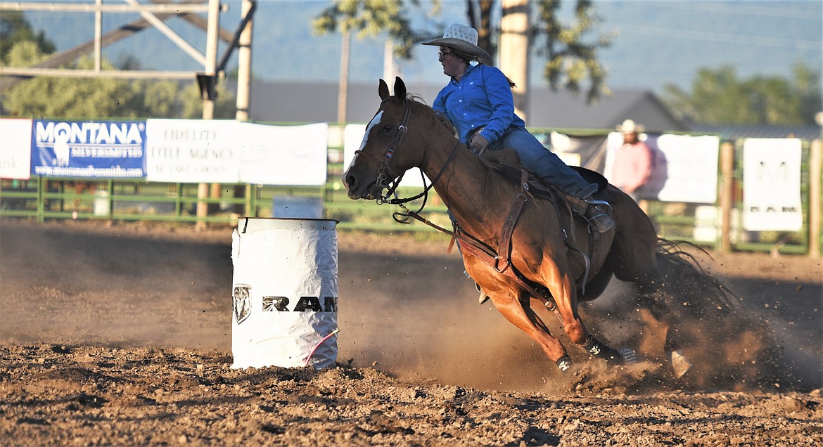 Madee Moses of Helmville rounds the final barrel. (Scot Heisel/Lake County Leader)