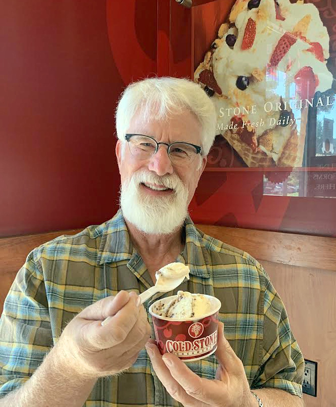 Gary Bolster enjoys ice cream inside the cool confines of Cold Stone Creamery at Riverstone on Tuesday.