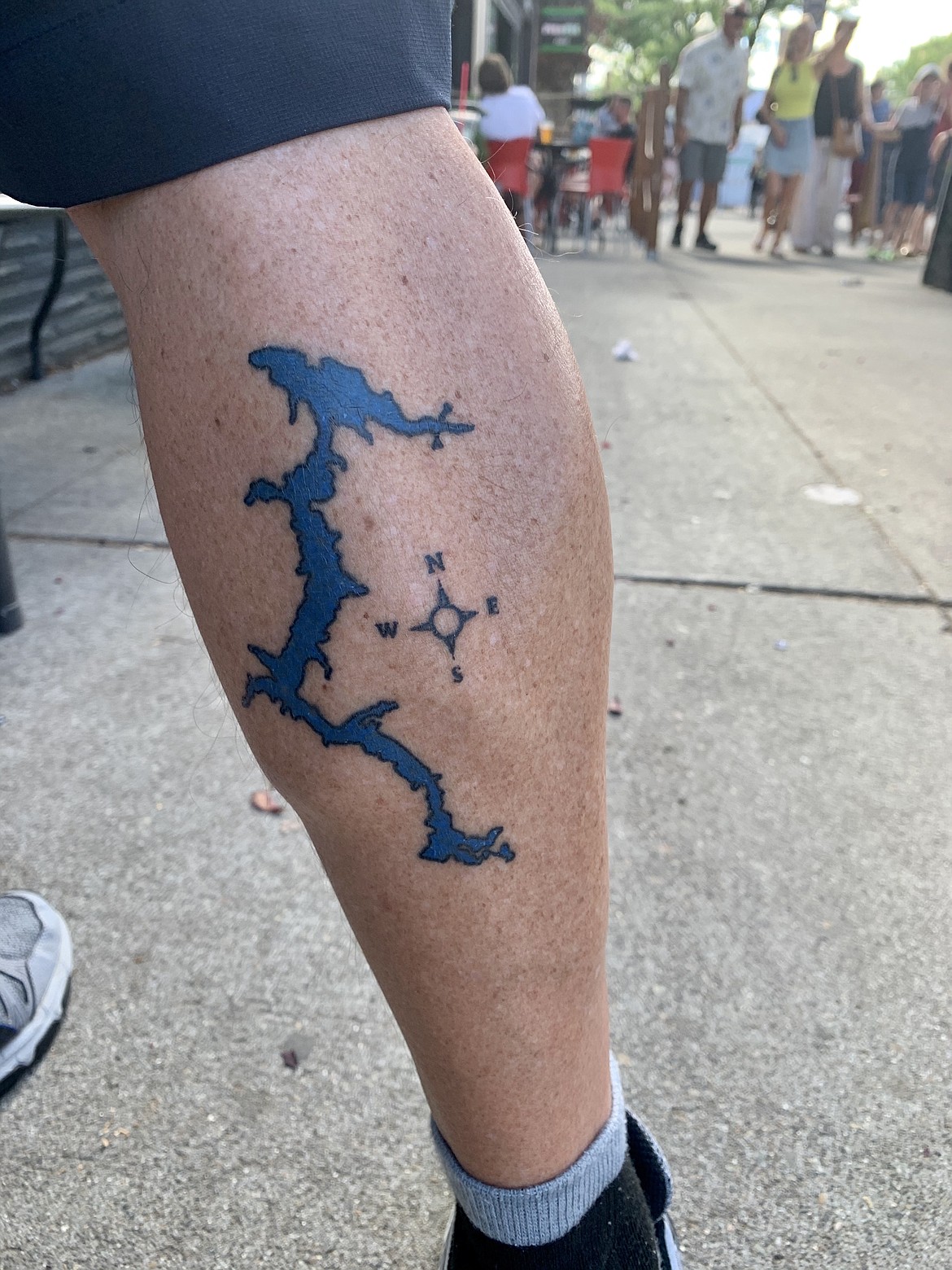 Captain Corky Meyer shows off his new tattoo of Lake Coeur d'Alene. Work done by tattoo artist, Christmas, at Artful Dodger Tattoo, 632 W. Appleway Ave. in Coeur d'Alene.