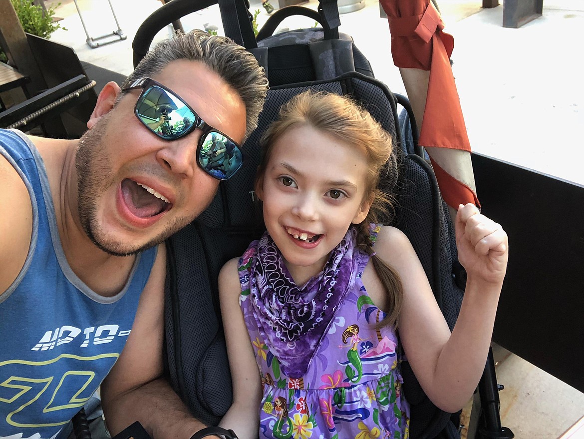 Nevaeh Silva, 9, of Hayden, pictured with dad, Jeff Silva, was diagnosed  with Rett syndrome with a MECP2 Gene disorder, a rare neurological disorder that affects her brain. Nevaeh received an online shopping spree in December as a wish granted through Make-A-Wish Idaho. Photo courtesy of Jeff Silva.