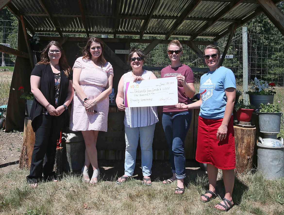 STCU presented a $1,000 check to the Panhandle Farm Corridor on June 29. From left: Amanda Doyle and Kristen Piscopo, STCU; Betty Mobbs, Emily Black and Lisa Pointer, Panhandle Farm Corridor.