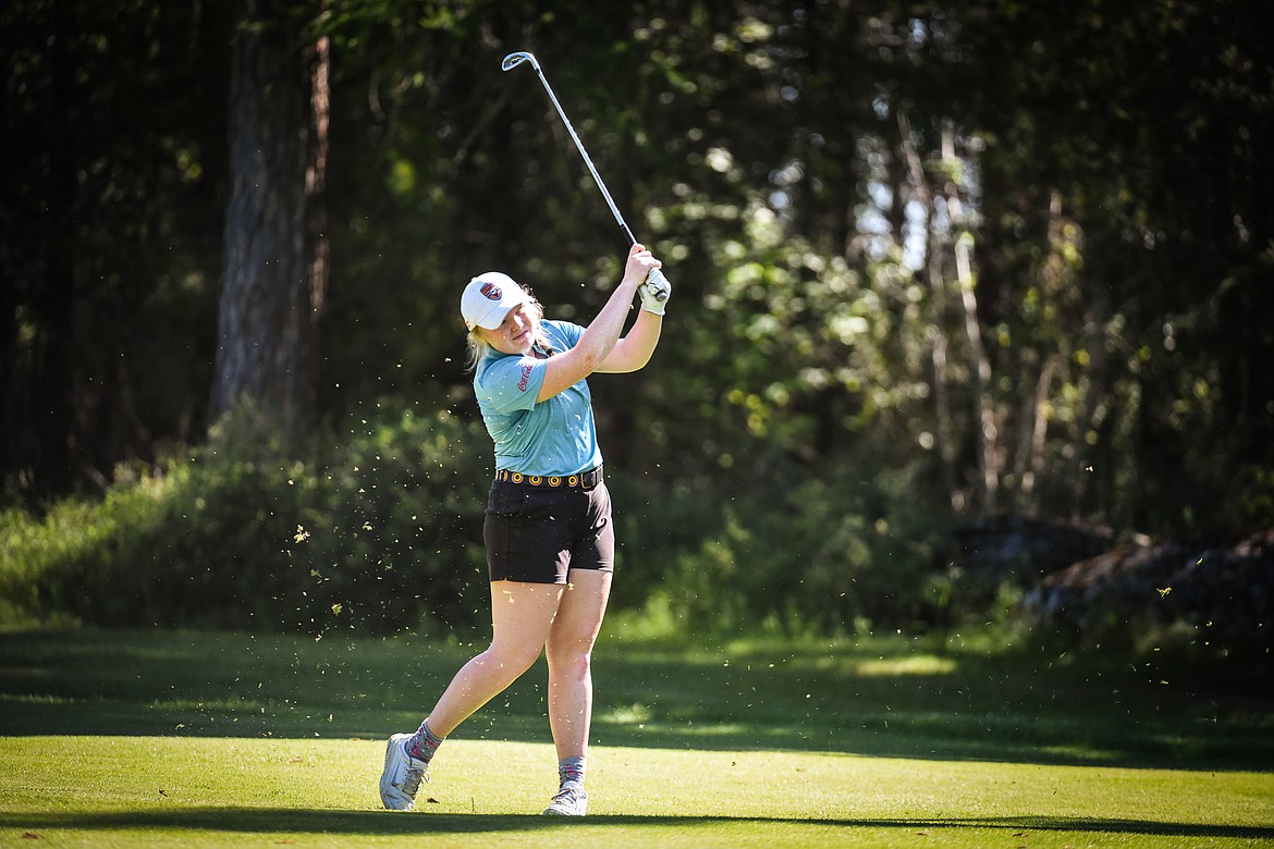 Marcella Mercer, of Kalispell, watches her approach shot on the 14th hole of the North Course during the opening round of the Earl Hunt 4th of July Tournament at Whitefish Lake Golf Club on Thursday, July 1. (Casey Kreider/Daily Inter Lake)
