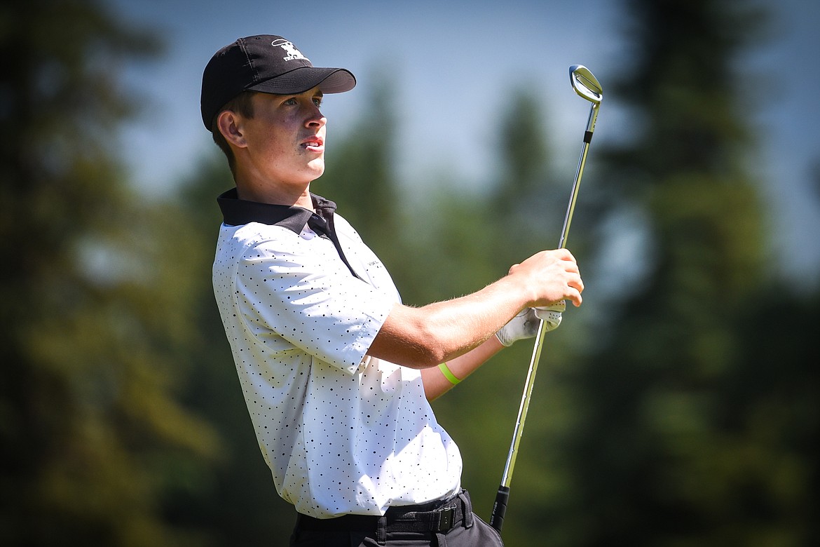 Tyler Avery, from Kalispell, watches his approach shot on the 5th hole of the South Course during the opening round of the Earl Hunt 4th of July Tournament at Whitefish Lake Golf Club on Thursday, July 1. (Casey Kreider/Daily Inter Lake)