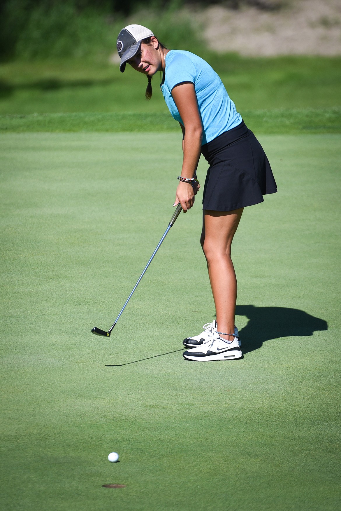 Defending champion Cora Rosanova putts on the 15th green of the North Course during the opening round of the Earl Hunt 4th of July Tournament at Whitefish Lake Golf Club on Thursday, July 1. (Casey Kreider/Daily Inter Lake)