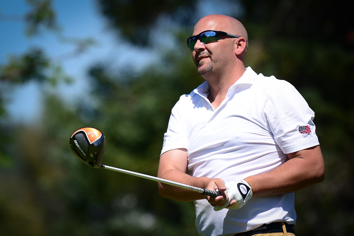 Shawn Tucker, of Whitefish, watches his drive off the first tee of the South Course during the opening round of the Earl Hunt 4th of July Tournament at Whitefish Lake Golf Club on Thursday, July 1. (Casey Kreider/Daily Inter Lake)