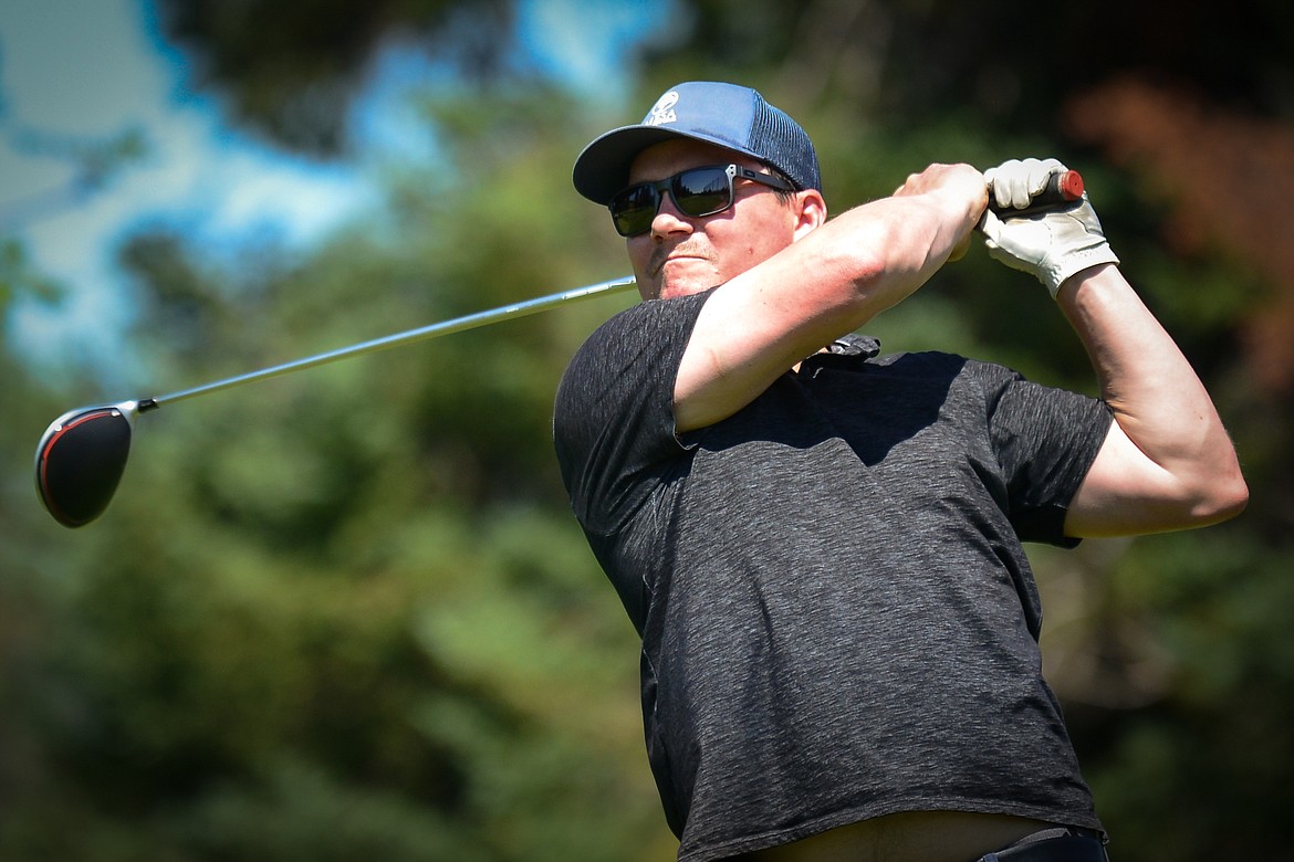 Dan Conkling, of Whitefish, watches his drive off the first tee of the South Course during the opening round of the Earl Hunt 4th of July Tournament at Whitefish Lake Golf Club on Thursday, July 1. (Casey Kreider/Daily Inter Lake)