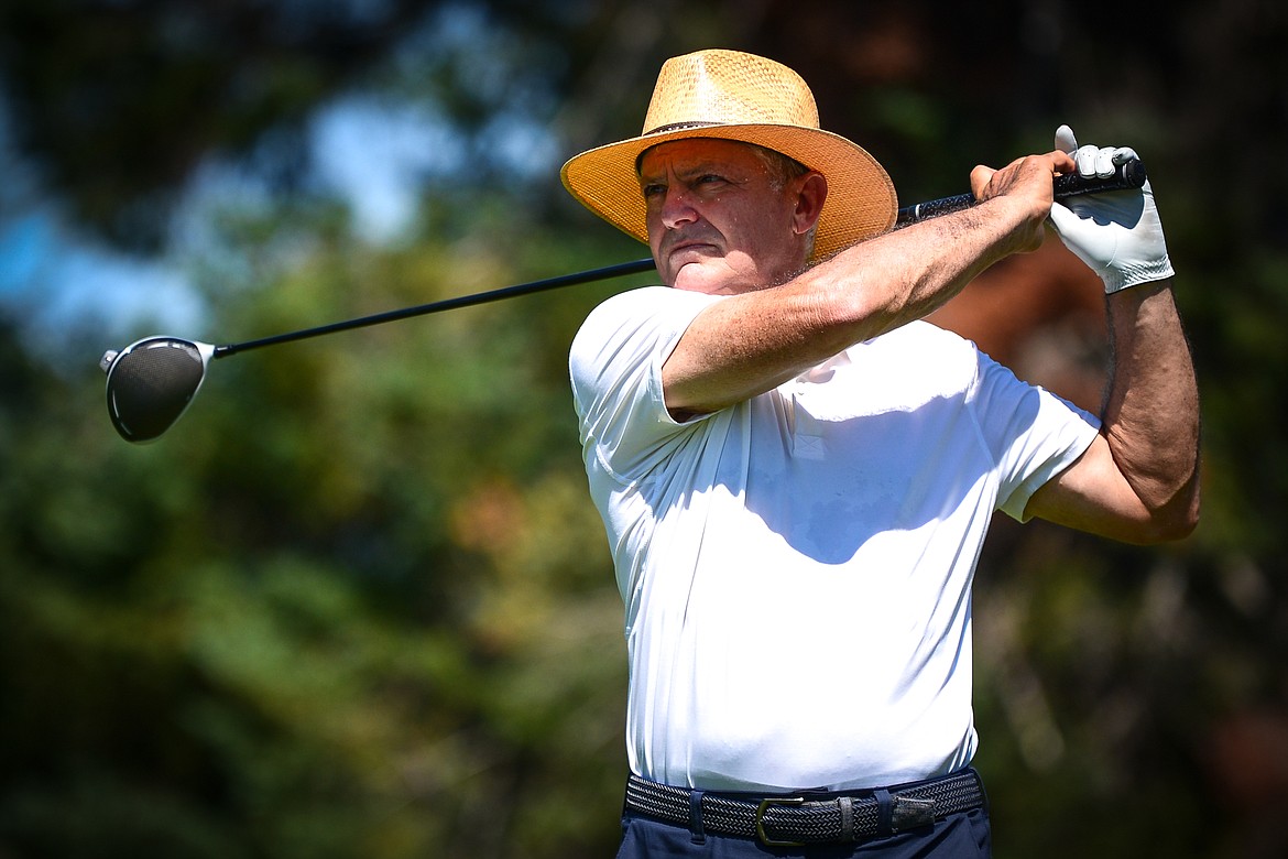 Marty Mehl watches his drive off the first tee of the South Course during the opening round of the Earl Hunt 4th of July Tournament at Whitefish Lake Golf Club on Thursday, July 1. (Casey Kreider/Daily Inter Lake)