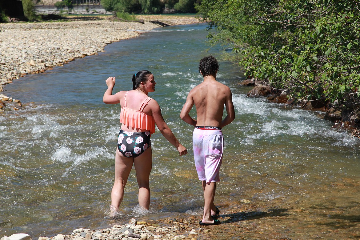 Phoenix Vincent, 14, and Nate Pena, 13, cool off at Libby Creek on June 30. The National Weather Service reported highs in Libby near 109 on Tuesday and issued an excessive heat warning that lasted until Thursday. (Will Langhorne/The Western News)