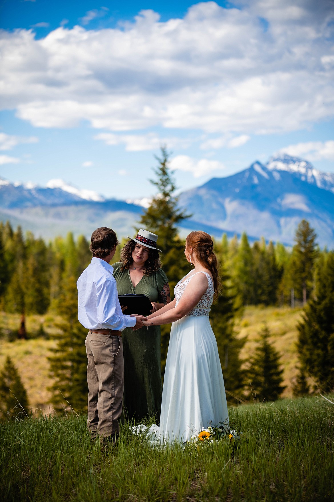 A couple recites their vows during an elopement in Northwest Montana. (Courtesy of Elope Montana).