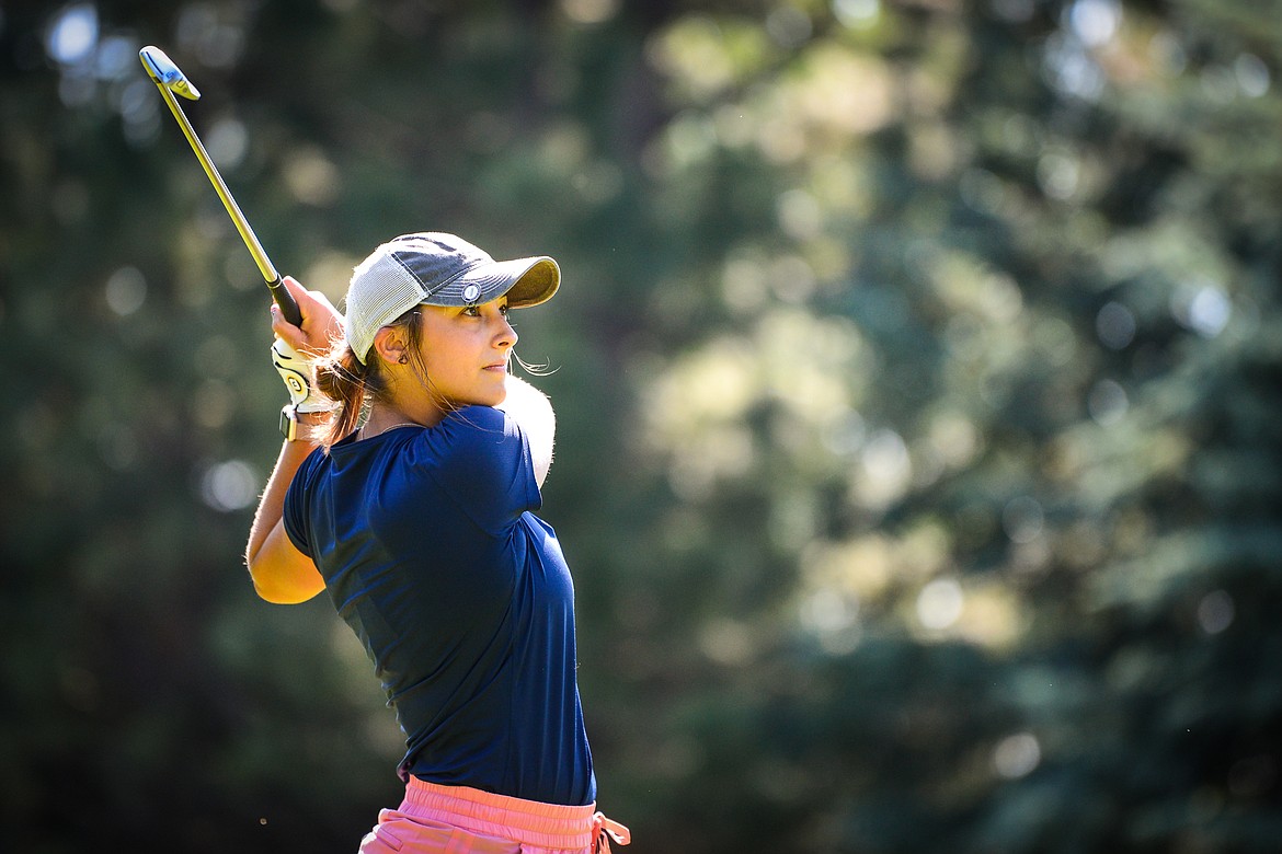 Hannah Rosanova watches her tee shot on the fifth hole of the South Course during the second round of the Earl Hunt 4th of July Tournament at Whitefish Lake Golf Club on Friday, July 2. (Casey Kreider/Daily Inter Lake)