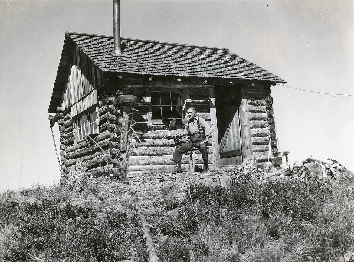 Harry Fulmer sits at his post outside the Haskill Mountain Lookout in the summer of 1937. (A.E. Boorman photo