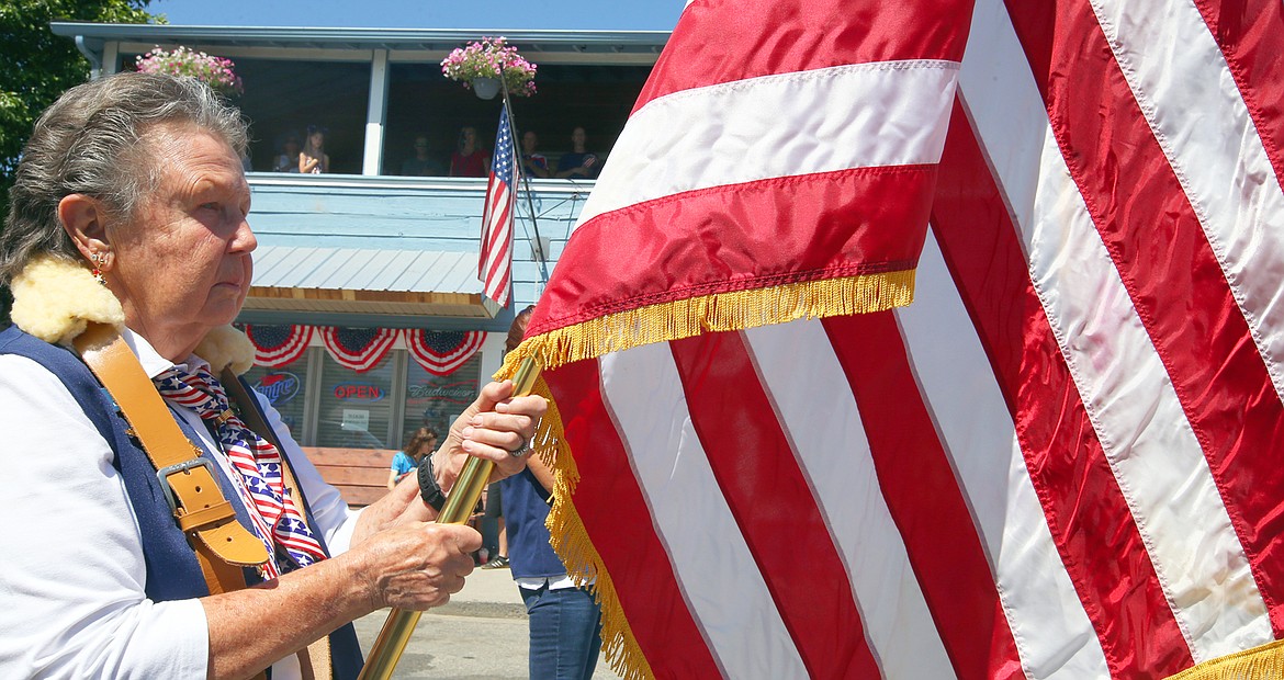 Joey Haines of Athol carries a flag in the Bayview Daze parade.
