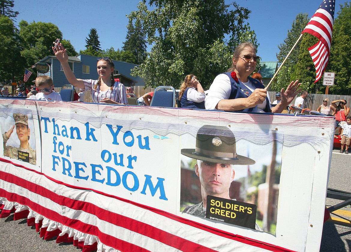 Jo-Ann Rasmussen of Athol American Legion Auxiliary 149 president, sits in a float in the Bayview Daze parade Saturday. To her right is Cheyenne Nelson.